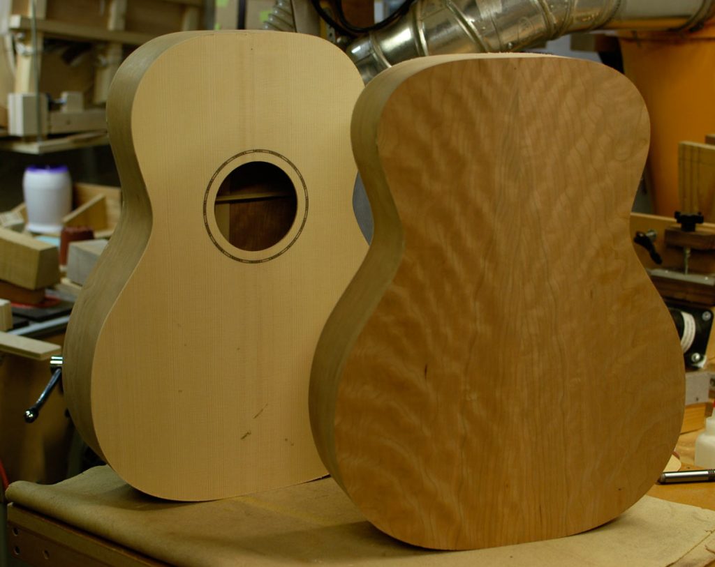 Front: orchestra prototype in American cherry, behind: auditorium prototype showing Adirondack spruce.