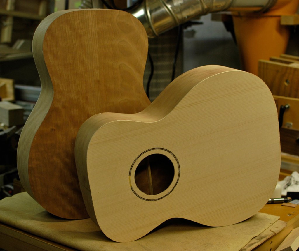 Front: orchestra prototype showing Adirondack spruce, behind: auditorium prototype showing American cherry.