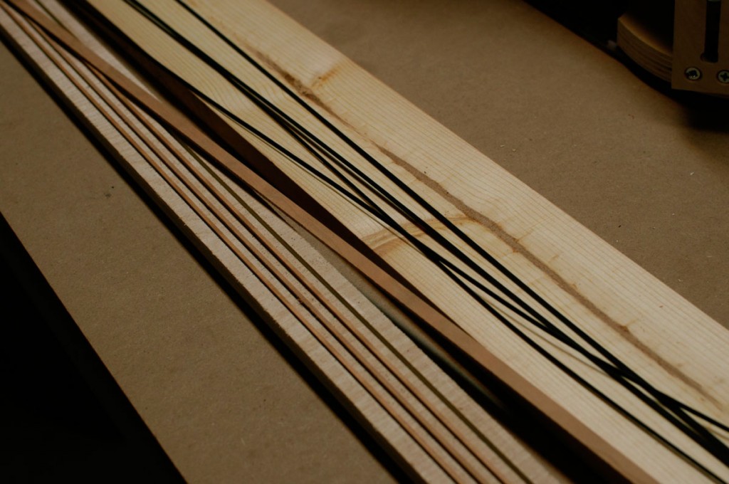 Cherry binding strips awaiting the addition of thin, black fiber purfling strips