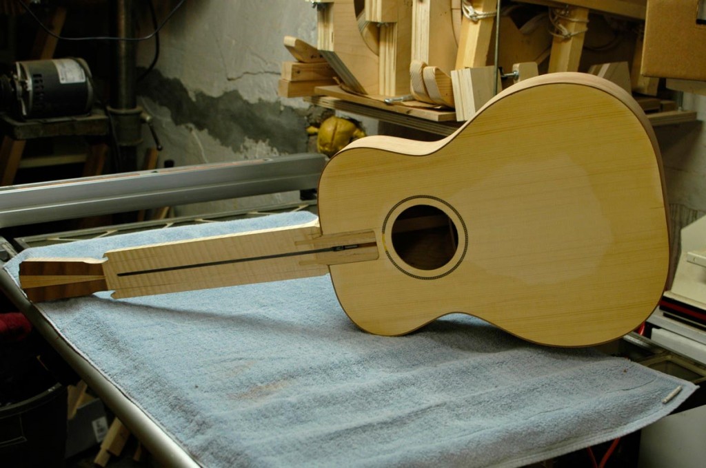 The orchestra prototype is fitted with a roughed-in neck. I can begin finishing the body while I carve the neck.