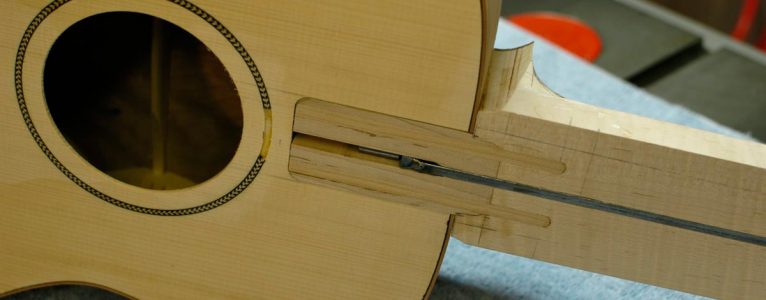 The new neck joint adds support for the fingerboard along its entire length.