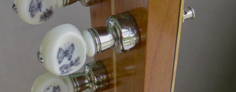 Tuner buttons for the tenor prototype engraved by Jean Gaddy.