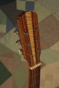 Orchestra guitar no 14 headstock front in hormigo with a maple wedge