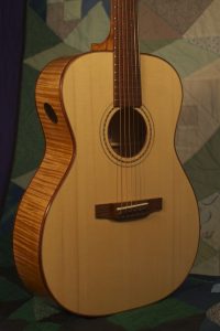 Orchestra guitar no 14 uses red maple sides and back and an Adirondack spruce top.