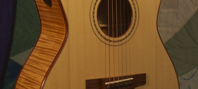 Orchestra guitar no 14 uses red maple sides and back and an Adirondack spruce top.