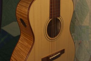 Orchestra guitar no 14 adds a soundport in the side to give the player a rich, direct sound.