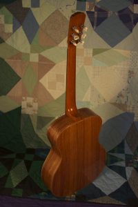 Orchestra guitar no 15 features palo escrito sides and back.