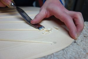 Shaving fan brace ends on a classical guitar top. Photo by Denny Brown.