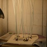 Gluing the braces in place using go bars in a radiused dish.