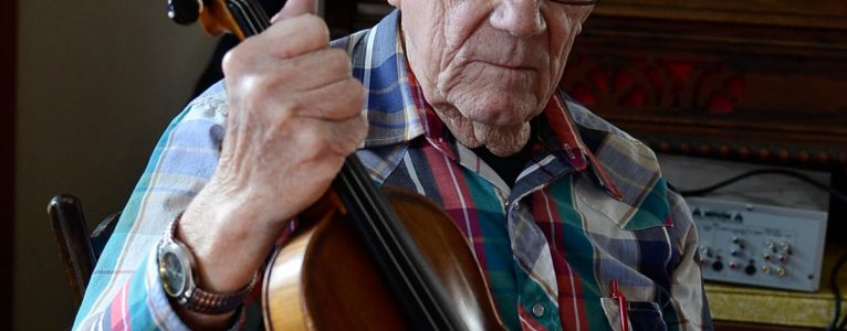 Dwight Lamb holds his fiddle