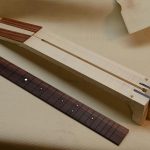 The neck has been registered to the neck blank using tiny brass pins.