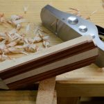 Planing the taper on the side of the headstock.