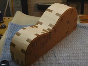 Maple guitar sides taped to a solid form.