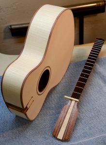 The guitar has been sanded down and is ready for finishing.