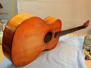 Spruce tops often have more curl than you think, and the dye accentuates the natural figure.