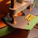 A router is used to cut the top off of a guitar