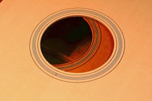 The rosette and soundhole of a guitar top