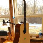 A guitar with the neck inserted.