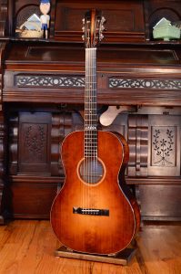 The entire front of a small guitar