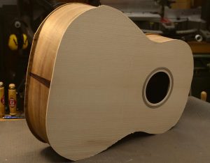 A freshly assembled acoustic guitar body.