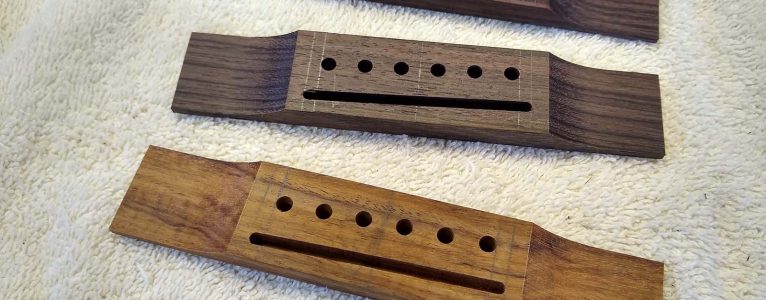 Three shaped guitar bridges